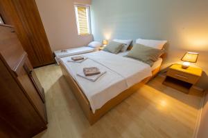 Giường trong phòng chung tại Villa Orange House