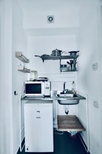Una cocina o cocineta en Assuta studio