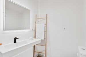 a bathroom with a sink and a mirror at Spiteri 12 by Pineapple Homes in Málaga +12 photos
