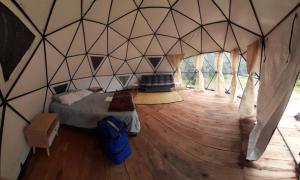 Voodi või voodid majutusasutuse Glamping Termales Aguatibia toas