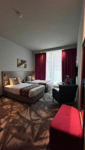 Postel nebo postele na pokoji v ubytování FORTUNE ATRIUM HOTEL