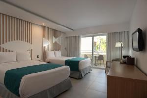 Postel nebo postele na pokoji v ubytování Select at Casa Marina Adults Only All Inclusive
