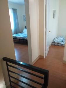 Postel nebo postele na pokoji v ubytování ESTILO APARTMENT 2-storey