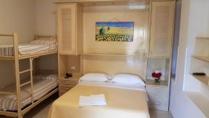 Postel nebo postele na pokoji v ubytování Hotel la Praia