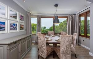 a dining room with a table and chairs at 4 Bedroom Beautiful Home In Kostrena in Kostrena