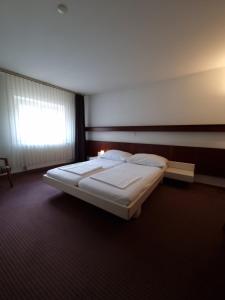 Postel nebo postele na pokoji v ubytování Spalenbrunnen Hotel & Restaurant Basel City Center