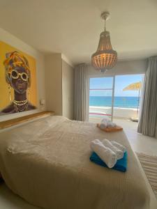a bedroom with a large bed with a large head at Miraflores Beach & Country Club in Mijas Costa
