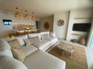 a living room with a couch and a table at Miraflores Beach & Country Club in Mijas Costa