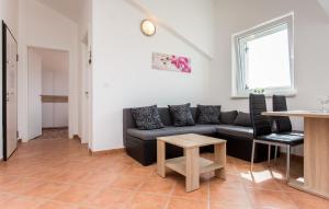 a living room with a couch and a table at Nives in Šilo