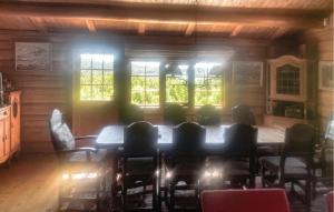 a dining room with a table and chairs at Awesome Home In Hemsedal With Sauna in Hemsedal