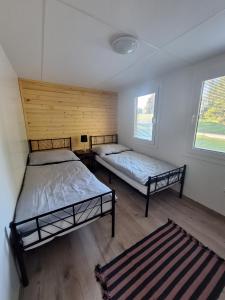 Postel nebo postele na pokoji v ubytování Arktik Lesní Mlýn