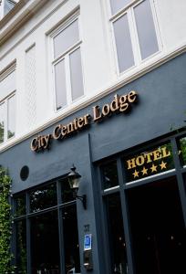 a city center lodge sign on the side of a building at City Center Lodge Utrecht in Utrecht