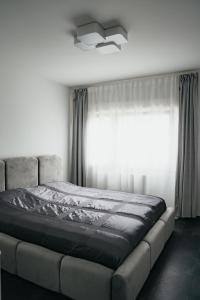 Ένα ή περισσότερα κρεβάτια σε δωμάτιο στο E&S Apartments 1