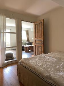 a bedroom with a bed and a sliding glass door at Sjöbacken in Braås