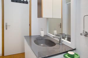 a bathroom with a sink and a mirror at Casa Nel Bosco in Sacco +20 photos