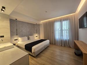Voodi või voodid majutusasutuse Nireus Hotel toas
