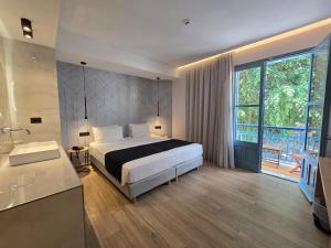 Voodi või voodid majutusasutuse Nireus Hotel toas