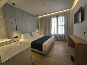 Voodi või voodid majutusasutuse Nireus Hotel toas
