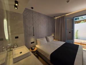 Voodi või voodid majutusasutuse Nireus Hotel toas