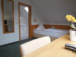 Postel nebo postele na pokoji v ubytování Hotel Schober