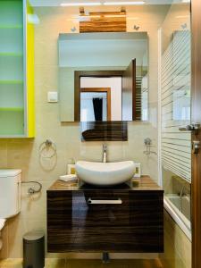 a bathroom with a sink and a toilet at Joy City Stay Forest 84 in Timişoara