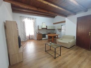 a living room with a couch and a table at B&b da Ely in Ventimiglia di Sicilia