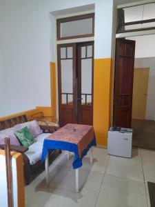 a room with a bed and a table in it at Casa de Huéspedes Cristina Recoleta Cristina Guesthouse Recoleta in Buenos Aires