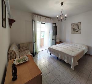 Ένα ή περισσότερα κρεβάτια σε δωμάτιο στο Casa Giulia