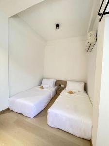 Postel nebo postele na pokoji v ubytování SWM Hotel