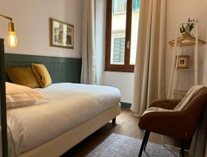 A bed or beds in a room at Affittacamere Zanobi 45