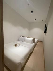 Postel nebo postele na pokoji v ubytování SWM Hotel