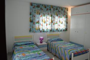 Łóżko lub łóżka w pokoju w obiekcie Villa Lagem