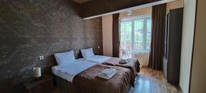 Postel nebo postele na pokoji v ubytování Hotel Svanseti