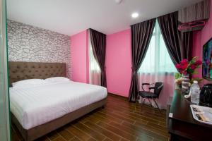 Postel nebo postele na pokoji v ubytování Elmark Hotel Johor