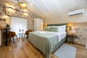 a bedroom with a large bed in a room at Kruna apartments est 2024 in Split