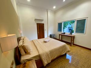 Muni Residence & Spa客房内的一张或多张床位