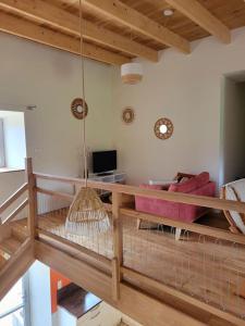 a living room with a hammock in a room at Charmante maison totalement rénovée in Saint-Géron