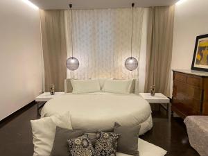 A bed or beds in a room at Atmosfere Puniche b&b