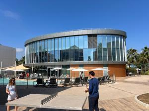 a man and woman standing in front of a building at SoBlue Hôtel in Antibes