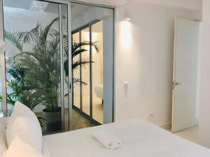 Posteľ alebo postele v izbe v ubytovaní Deluxe La Palma