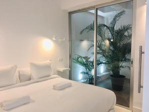 Posteľ alebo postele v izbe v ubytovaní Deluxe La Palma