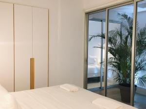 Posteľ alebo postele v izbe v ubytovaní Deluxe La Palma