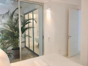 Posteľ alebo postele v izbe v ubytovaní Deluxe La Palma