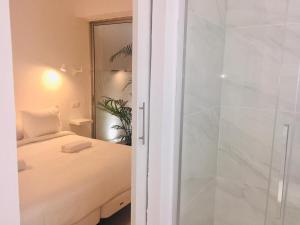 Posteľ alebo postele v izbe v ubytovaní Deluxe La Palma