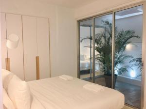 Posteľ alebo postele v izbe v ubytovaní Deluxe La Palma