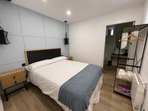 Ένα ή περισσότερα κρεβάτια σε δωμάτιο στο Apartamento 04