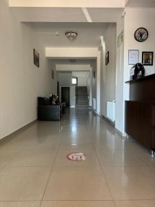 a hallway of a building with a tile floor at Orient Mamaia Nord in Mamaia Sat/Năvodari