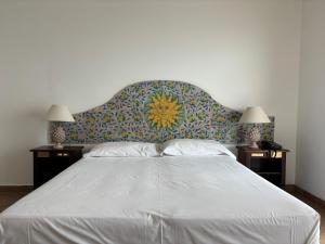Postel nebo postele na pokoji v ubytování Bay Palace Mazzarò