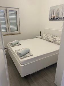 Ένα ή περισσότερα κρεβάτια σε δωμάτιο στο Apartment Brijesta 10223a