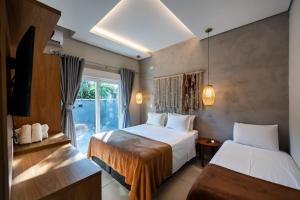 Cama ou camas em um quarto em Casatua Pousada